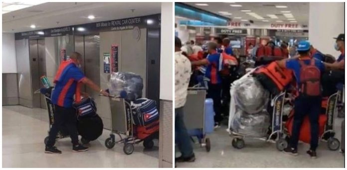 Peloteros cubanos que participaron el Torneo Preolímpico en Florida son captados en aeropuerto cargados de equipajes antes de regresar a Cuba